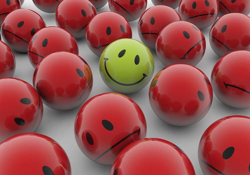 saap-800_0000_3d-rendering-illustration-red-balls-with-sad-emotions-green-happy-one-white-surface
